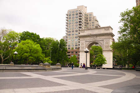 NEW YORK CITY - MAY 24, 2020:  Washington Square Park in Manhattan during the Covid-19 Coronavirus Pandemic with people wearing protective masksのeditorial素材