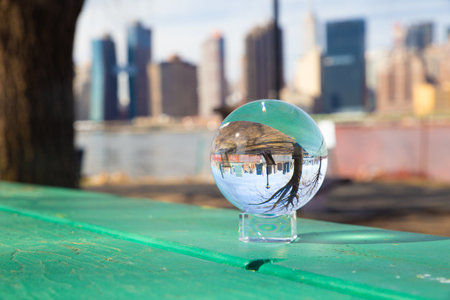 New York City seen through glass ball from Long Island Cityの写真素材