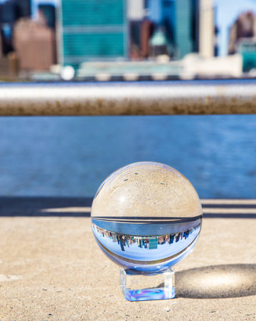 New York City seen through glass ball from Long Island Cityの写真素材