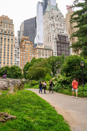 New York City - June 12, 2021:  View of Central Park in Manhattan on a Saturday afternoon with people visiting and relaxing.のeditorial素材