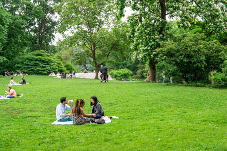 New York City - June 12, 2021:  View of Central Park in Manhattan on a Saturday afternoon with people visiting and relaxing.のeditorial素材