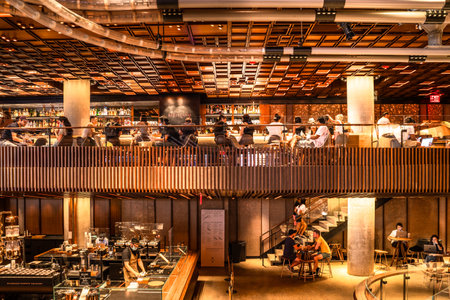 New York City, New York, USA - July 15, 2021: View inside of the Starbucks Reserve New York Roastery with people visible seen from Chelsea.のeditorial素材
