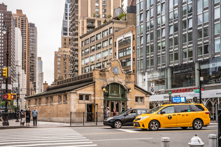 New York City, New York - June 12, 2021:  Manhattan Street scene at the 72nd Street subway station with people and cars visible.のeditorial素材