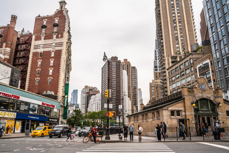 New York City, New York - June 12, 2021:  Manhattan Street scene at the 72nd Street subway station with people and cars visible.のeditorial素材