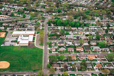 Aerial view of suburban community on Long Island New York with homes and streets visibleの写真素材