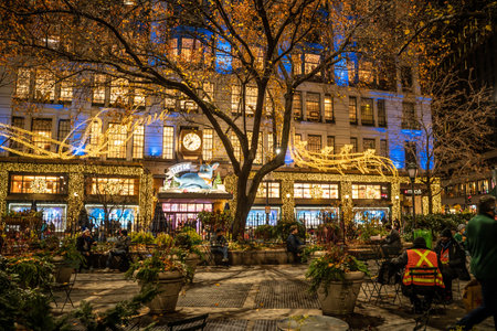 New York City, New York, USA - December 15, 2021:  View of Macy's Department store in Herald Square in Midtown Manhattan with historic Christmas window decorations seen illuminated at night.のeditorial素材