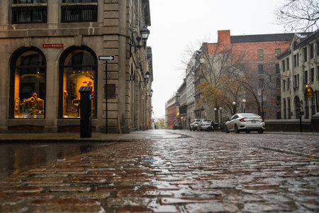 Montreal, Canada - November 6, 2022: Street scene from the historic Old Montreal district on a rainy day.のeditorial素材