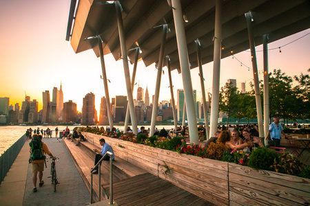 Long Island City, New York - July 13, 2019:  View at sunset from Gantry Plaza State Park in Queens New York City.のeditorial素材