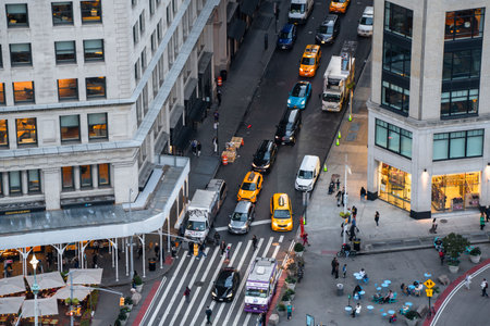 New York City, New York - October 12, 2023: Street scene from Midtown Manhattan, NY seen from overhead showing cars, people and buildingsのeditorial素材