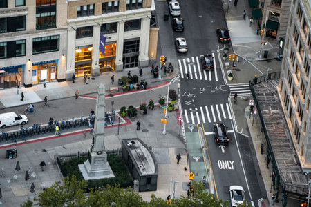 New York City, New York - October 12, 2023: Street scene from Midtown Manhattan, NY seen from overhead showing cars, people and buildingsのeditorial素材
