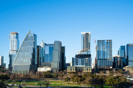 Austin Texas skyline at sunset with modern downtown buildings.