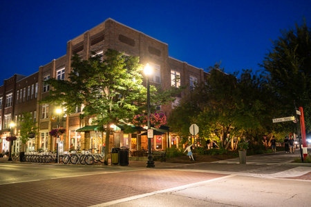 Carmel, Indiana - July 25, 2024:  Night street scene from midwest suburban city of Carmel Indiana along the Monon Trail near the Arts and Design District.のeditorial素材