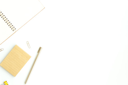 notebook paper, sticky note with pen, paper clip on white backgroundの写真素材