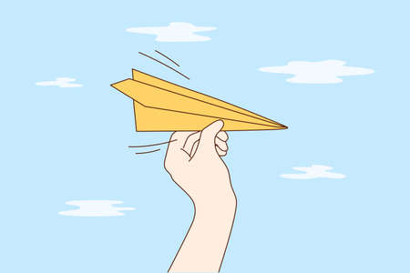 Travelling, business, delivery, flight concept. Man woman cartoon hands hold handmade paper plane flying in sky demonstrating email letter delivering. Leisure games and travel journey illustration.のイラスト素材