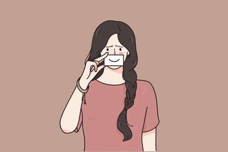 Mental disorder, depression, grief concept. Young sad unhappy woman holding paper smile on face...