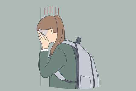 Depression, child bullying at school concept. Sad unhappy depressed young schoolgirl covering her face and crying against wall at school feeling lonely abused vector illustrationのイラスト素材