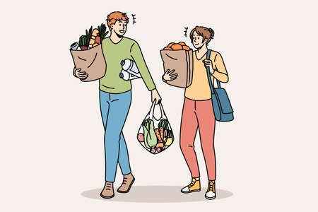 Shopping and buying fresh food concept. Young smiling couple man and woman cartoon characters walking carrying fresh food after going to grocery store vector illustrationのイラスト素材