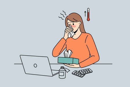 Feeling fever and ill concept. Young woman worker cartoon character sitting in office at laptop having high temperature and sick vector illustrationのイラスト素材
