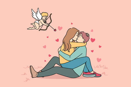 Cupid shooting at couple in loveのイラスト素材