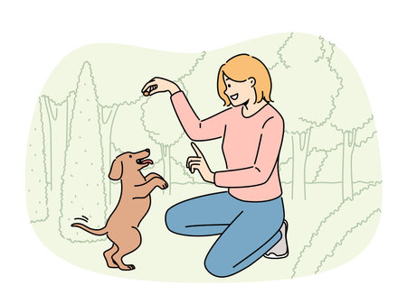 Smiling girl playing with dog in parkのイラスト素材