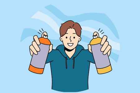 Man street artist draws graffiti holding two cans of paint in hands and with smile looks at screenのイラスト素材