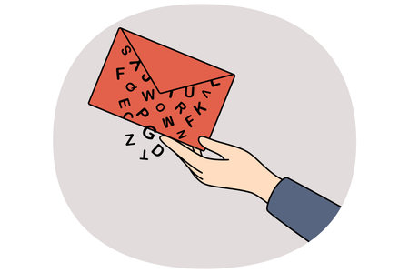 Envelope with letter in hand of person sending message with letters falling out.