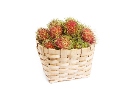 rambutan in basket on white backgroundの写真素材