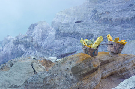 Sulfur carriers basket at Kawah Ijenの写真素材