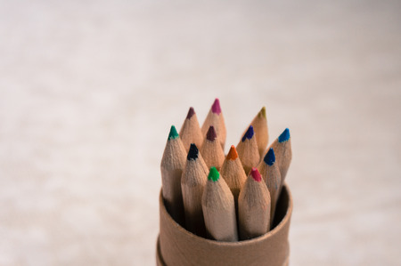 Multiple wood colored pencils in a paper cup.の写真素材