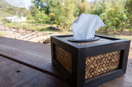 Tissue box on the table with nature background. Selective focusの写真素材