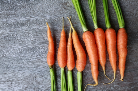 close up fresh carrot on wooden table.