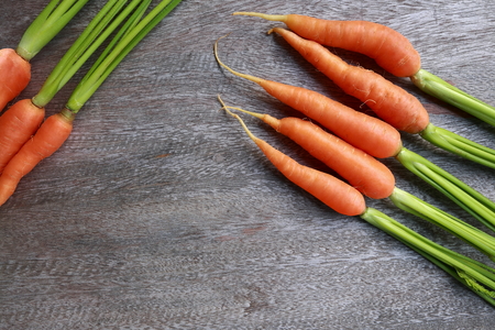close up group of fresh carrot on wooden table.の写真素材