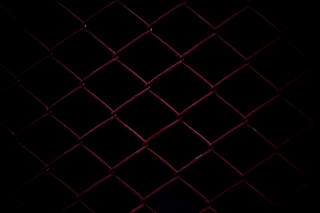Metal Mesh Fence isolated on black background.