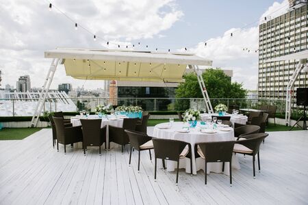 The wedding decor. The white flowers bouquet. wedding location. open space on the roof. turquoise tonesの写真素材