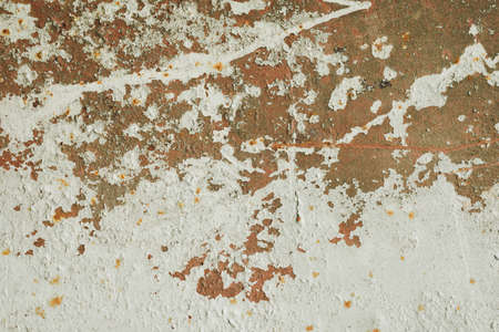rusty metal wall with cracked paint, rust through the paint. background, texture