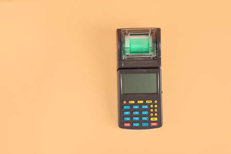 Portable cash register on beige background. Safe Shopping online concept. top view. minimalism