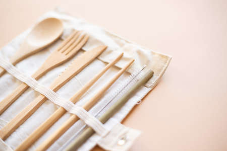 Reusable Eco-friendly Bamboo Cutlery Set on beige background, Alternative accessory, zero waste and plastic free concept. Copy spaceの写真素材