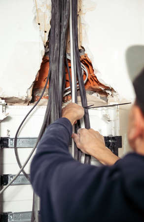 Electrical wires in the electrical panel. Repair in the apartment. Connecting the light....
