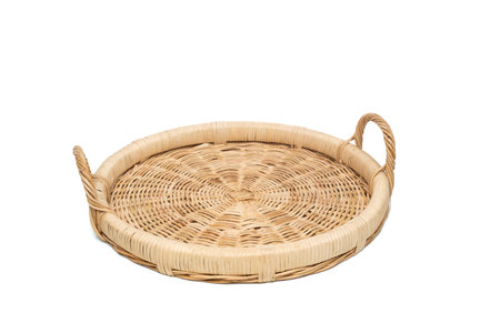 round rattan basket with handles isolated on white background. high quality photoの写真素材
