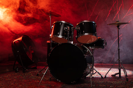 Drums and drum set. Beautiful blue and red background, with rays of light. Beautiful special effects of smoke and lighting. Music instrument. The concept of music.の写真素材