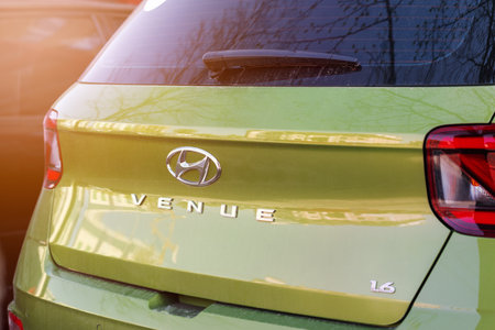 Ukraine, Kyiv, April 10, 2024. Rear view of Hyundai Venue green apple car close-up. Exterior detail automobile.のeditorial素材