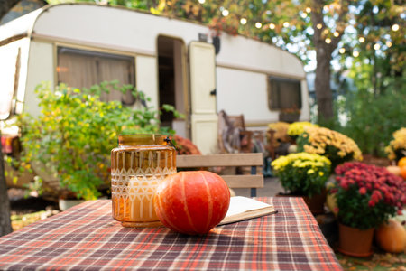 Pumpkin and decoration on garden table. Decorated garden with pumpkins and chrysanthemums. Front Porch decorated for Halloween, Thanksgiving. Fall season.の写真素材