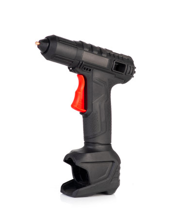 Cordless hot glue gun isolated on a white background. Black and red ergonomic designの写真素材