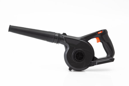 Electric air blower tool isolated on white background. Compact and powerful equipment for dust...