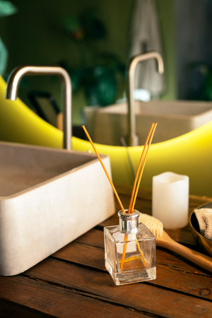 A stylish bathroom with an aroma diffuser and other spa accessories, creating a sense of relaxation...