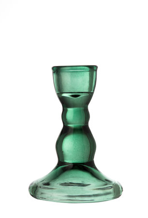 A vintage-style emerald green glass candlestick holder with a classic shape, isolated on a clean white background.の写真素材
