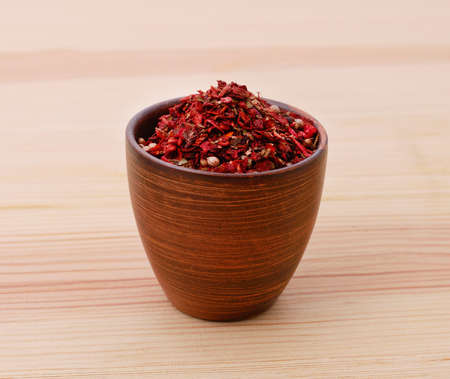 Pot of spices on a wooden background.の写真素材