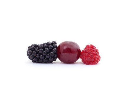 Raspberry blackberry and cherry isolated on a white background.の写真素材