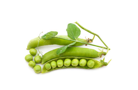 Green pea pods with leaves isolated on a white background.の写真素材