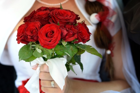 Bride, who holds a bouquet of rosesの写真素材